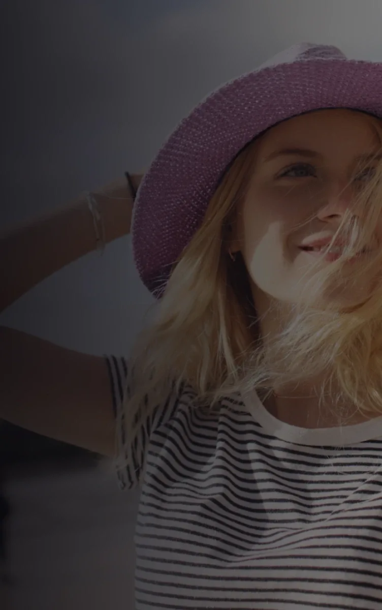 A woman in a pink hat