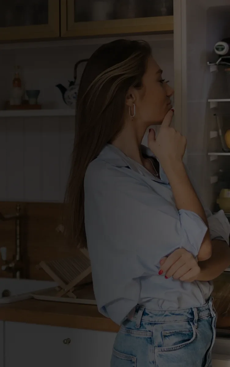 A woman looking through a kitchen