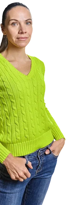 Woman in a bright green sweater standing confidently against a purple background, next to text saying Aim Lower.